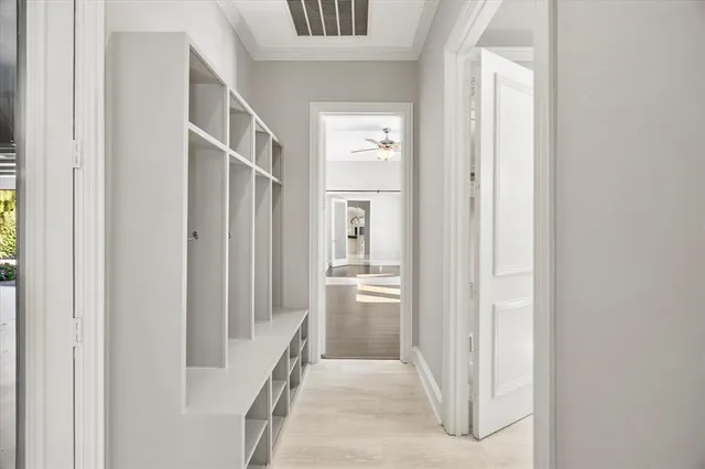 a view of a kitchen with white cabinets