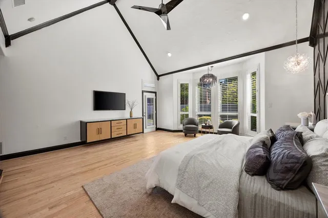 a large bathroom with a double vanity sink a mirror and a bathtub