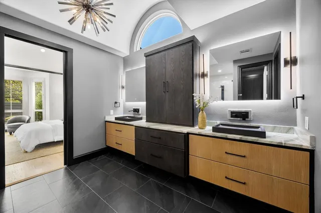 a bathroom with a glass shower door