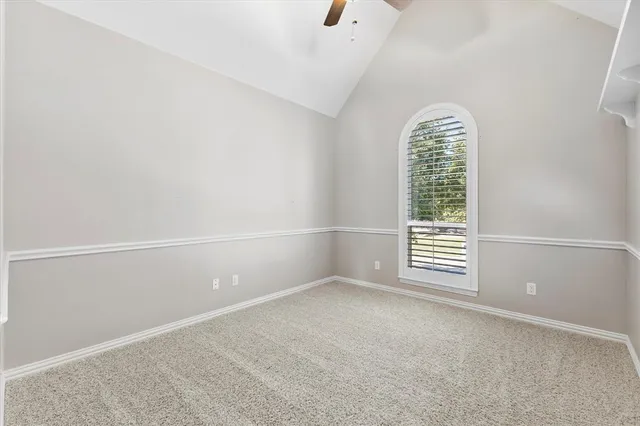 a bathroom with a granite countertop sink mirror vanity and toilet