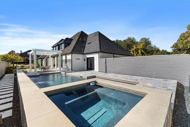 a spacious bedroom with a large bed and a large window