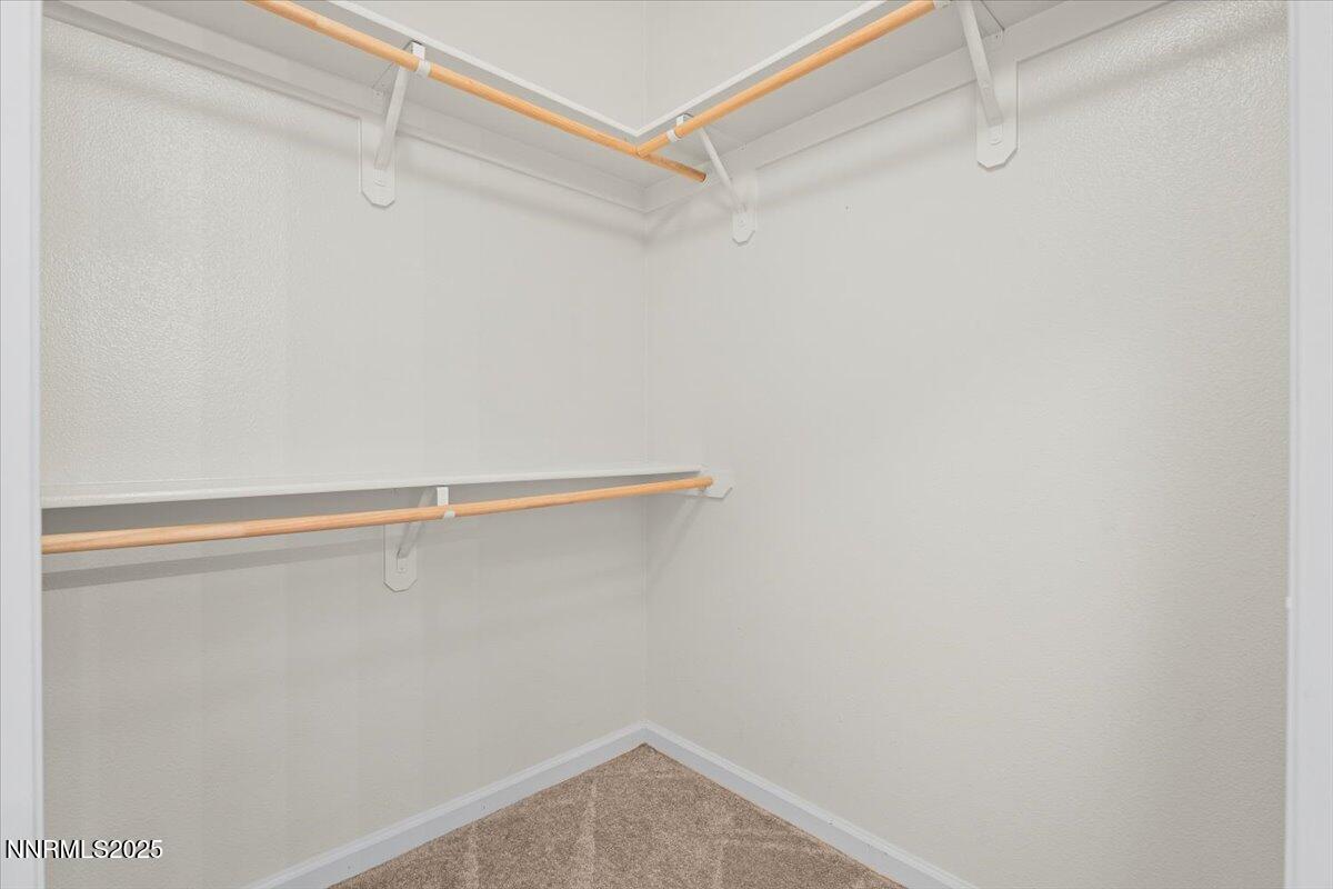 9050 Double R Boulevard, Unit 821 Reno, NV 89521 - Photo 12 of 20 a view of a room with racks on the wall