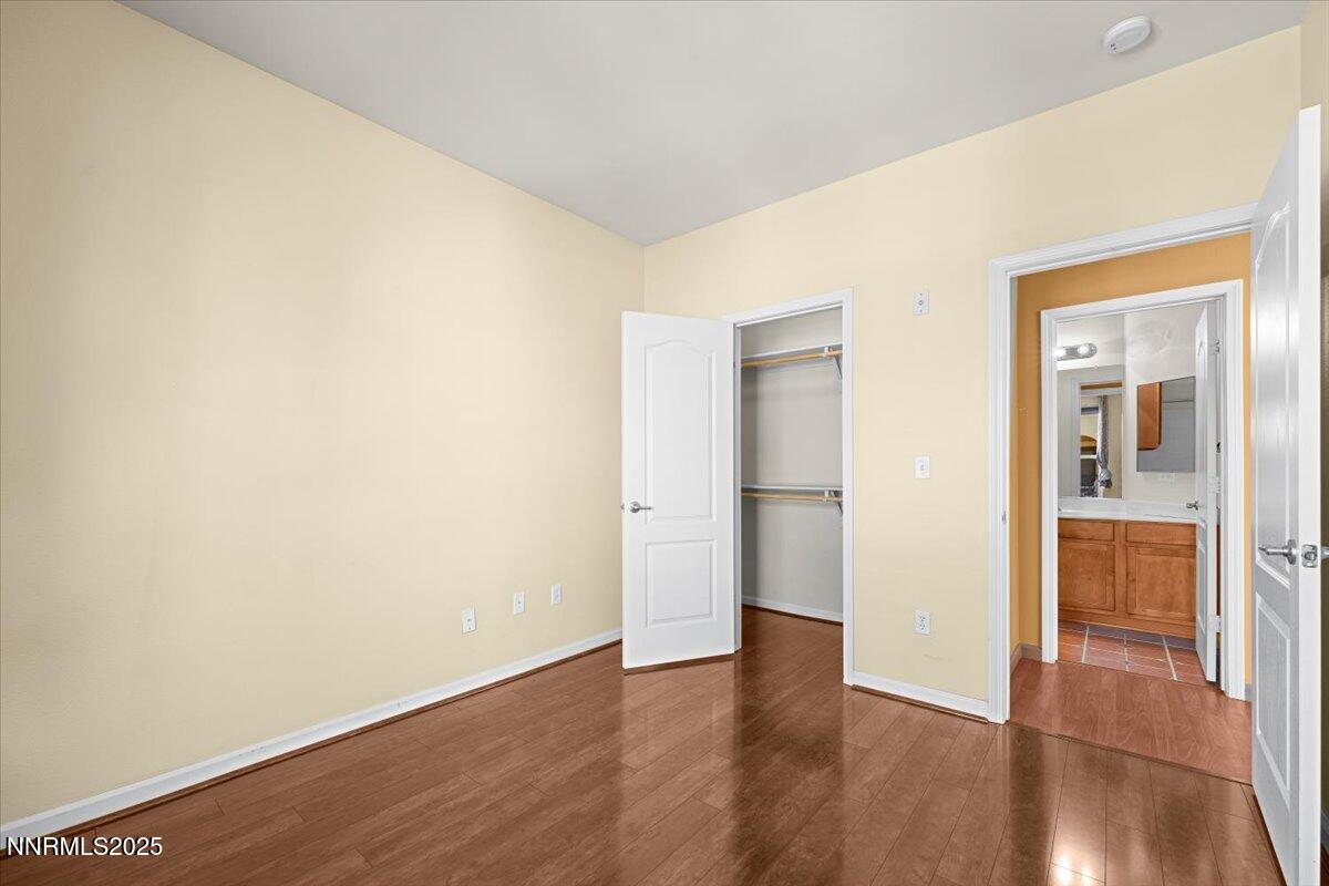 9050 Double R Boulevard, Unit 821 Reno, NV 89521 - Photo 14 of 20 a view of a hallway with wooden floor
