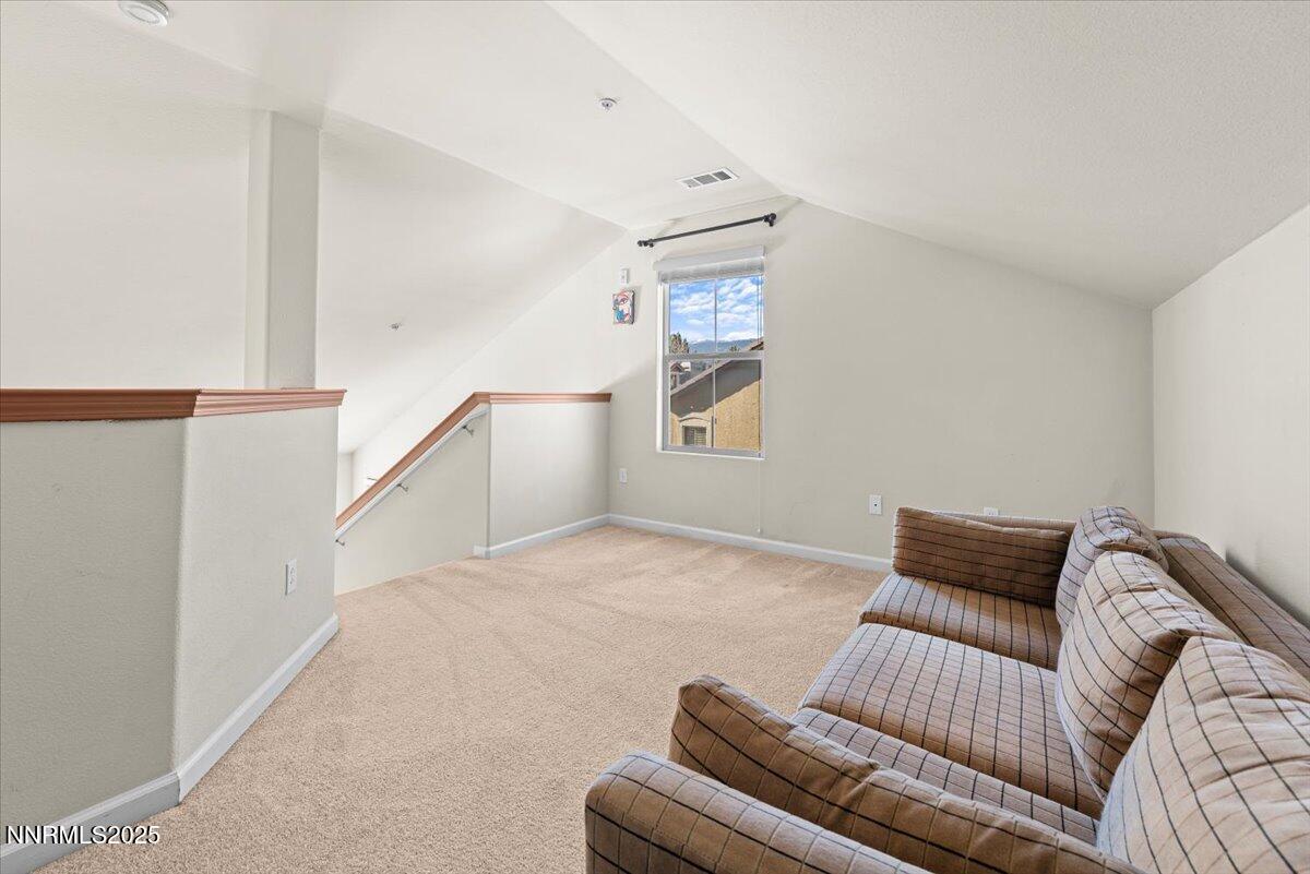 9050 Double R Boulevard, Unit 821 Reno, NV 89521 - Photo 16 of 20 a bedroom with furniture and a couch