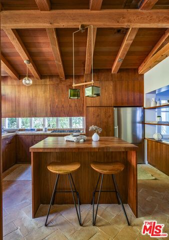 a kitchen with a table and chairs in it