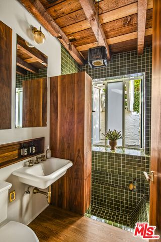 a bathroom with a sink and mirror