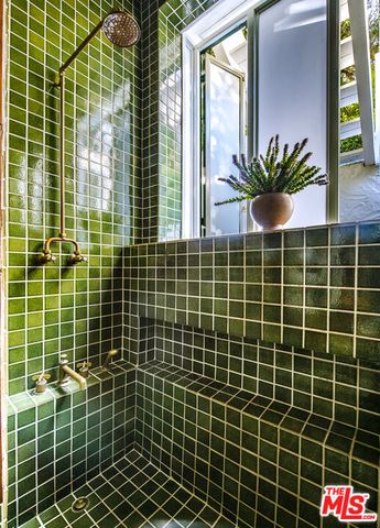 a view of a balcony with a potted plant