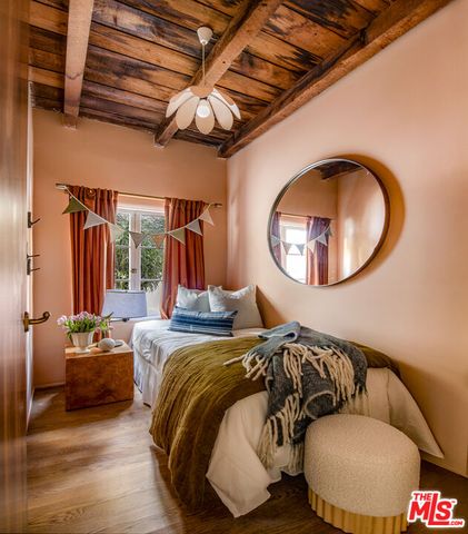 a bedroom with bed and a couch