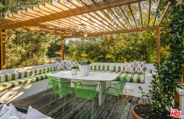 a front view of a house with plants