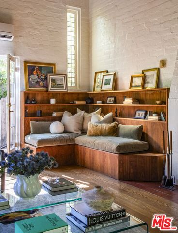 a living room with furniture and a rug