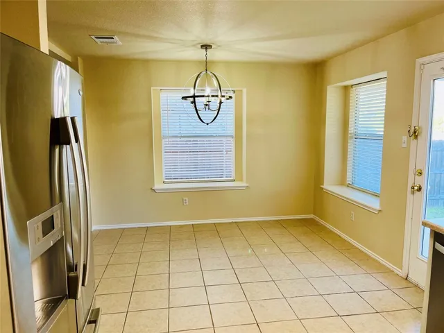 a view of empty room with a bathroom
