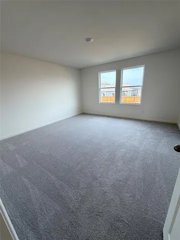 a spacious bathroom with a double vanity sink and a mirror
