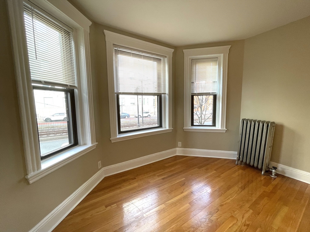 660 Huntington Avenue, Unit 14 Boston, MA 02115 - Photo 4 of 19 a view of empty room with wooden floor and fan