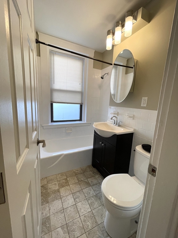 660 Huntington Avenue, Unit 14 Boston, MA 02115 - Photo 6 of 19 a bathroom with a sink toilet and shower