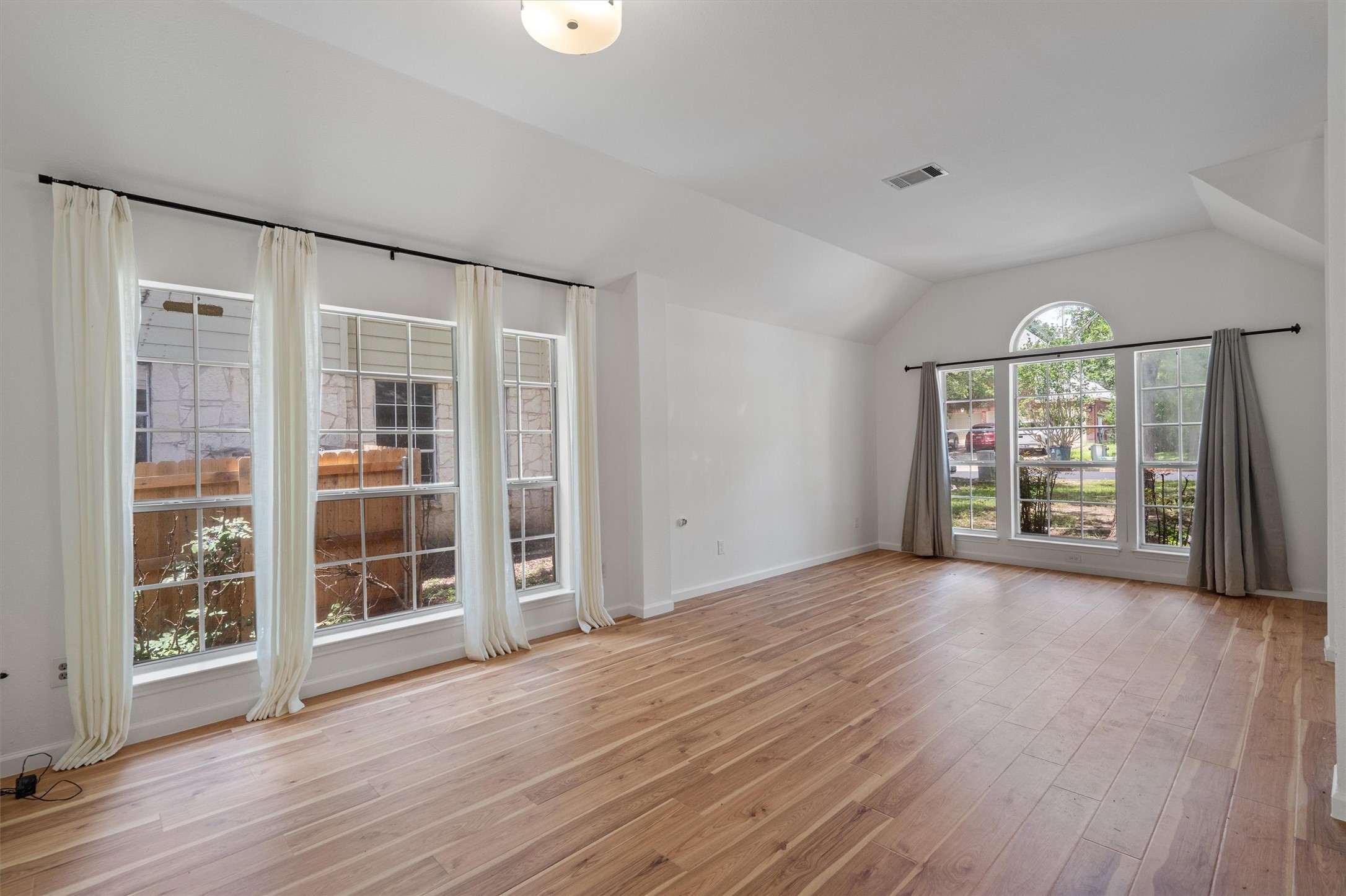 100 Parque Circle Georgetown, TX 78626 - Photo 4 of 39 wooden floor in an empty room with a window