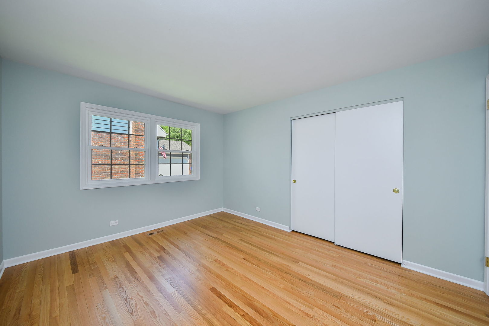 541 Williamsburg Road Glen Ellyn, IL 60137 - Photo 27 of 45 an empty room with wooden floor and windows