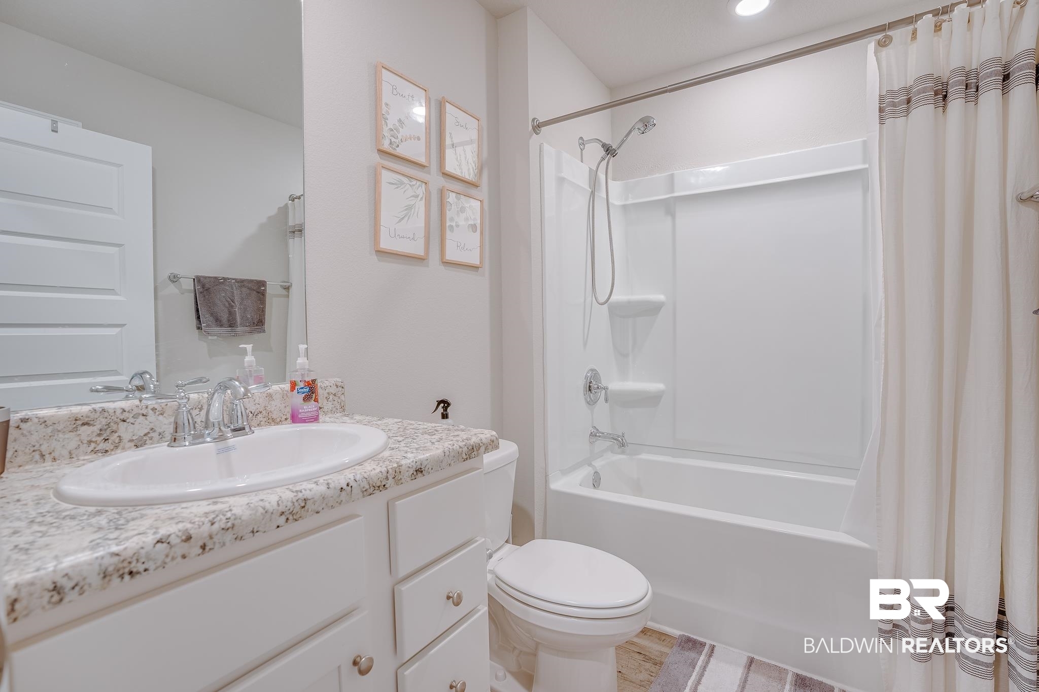 8242 Sycamore Way Semmes, AL 36575 - Photo 27 of 43 Full bathroom with shower / bath combination with curtain and vanity