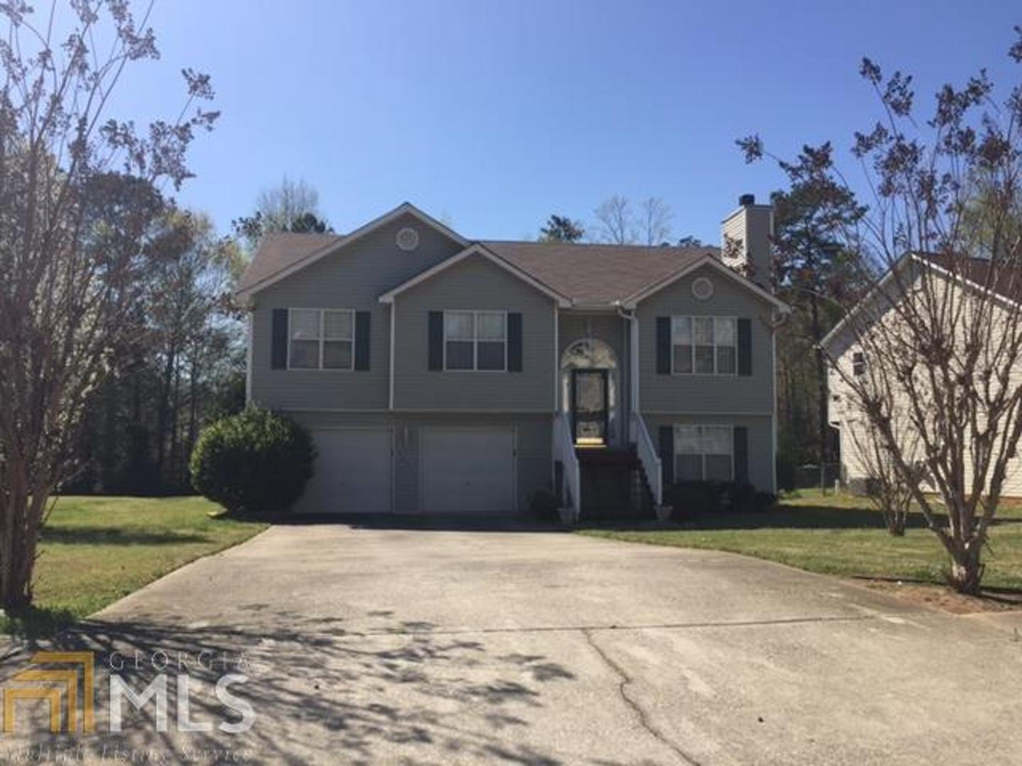 5871 Ruby Walk Rex, GA 30273 - Photo 1 of 1 a front view of a house with a yard