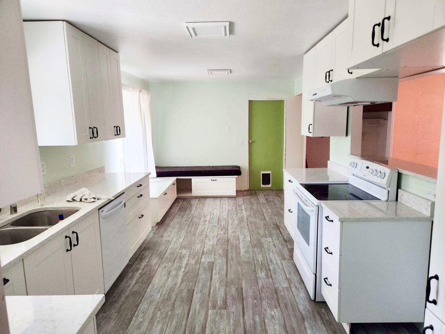 819 Lewis Road Watsonville, CA 95076 - Photo 20 of 32 a kitchen with sink a stove and cabinets