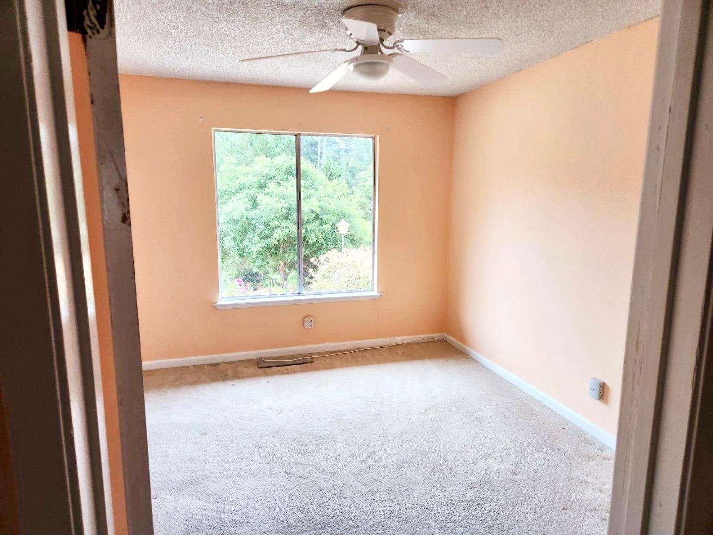 819 Lewis Road Watsonville, CA 95076 - Photo 26 of 32 an empty room with a window