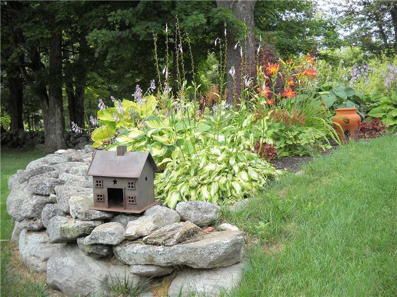289 Chick Road Lebanon, ME 04027 - Photo 33 of 33 Exterior Back. One of many flower...