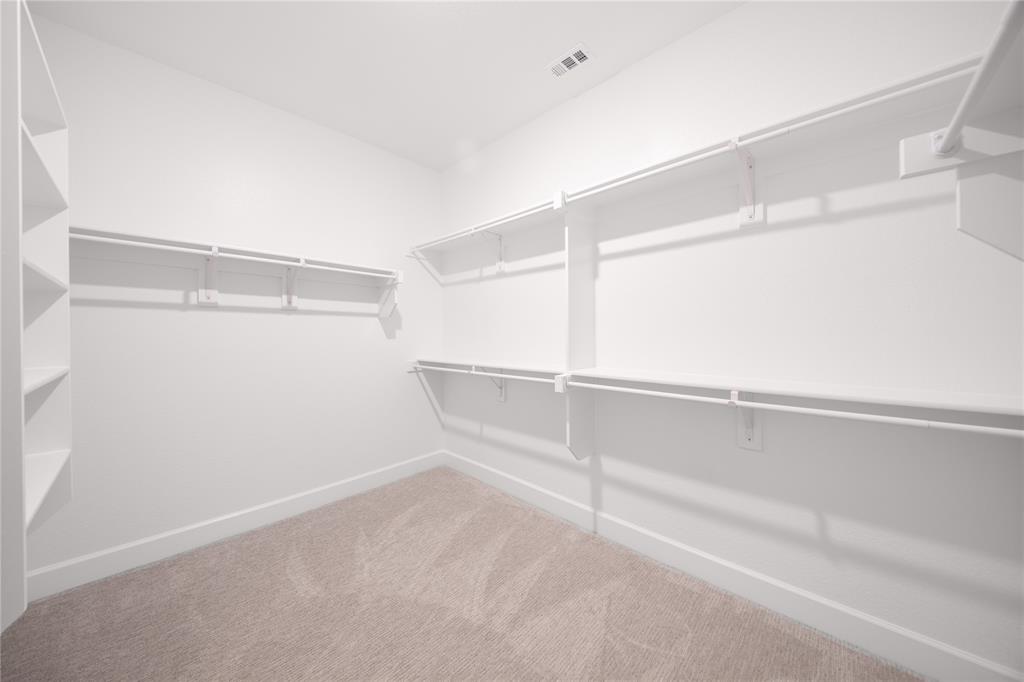 2719 Triumph Court Heath, TX 75126 - Photo 29 of 39 a view of an empty walk in closet