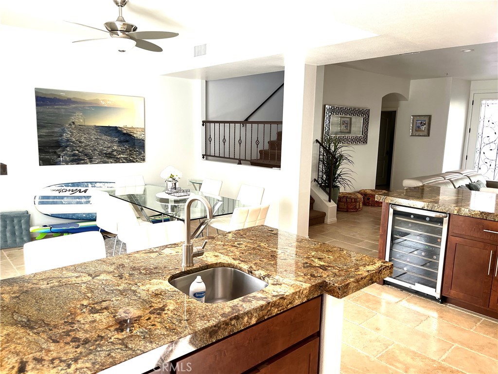 332 5th Street Huntington Beach, CA 92648 - Photo 9 of 11 a kitchen with granite countertop a sink and a stove