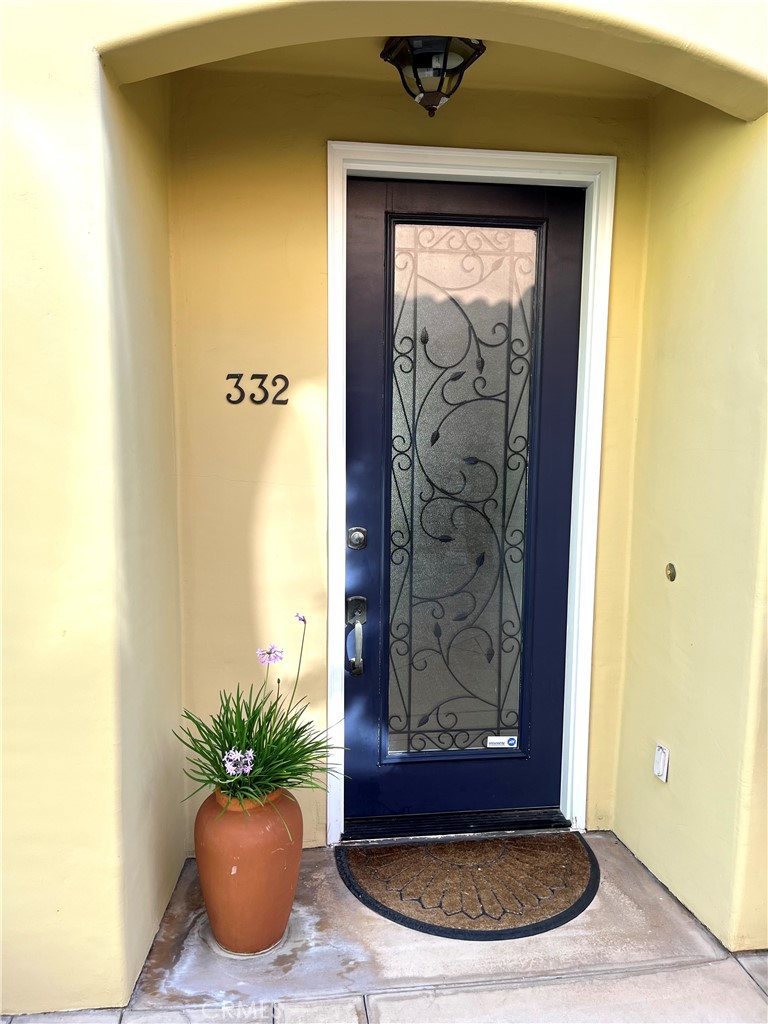 332 5th Street Huntington Beach, CA 92648 - Photo 10 of 11 a view of a door with a potted plant