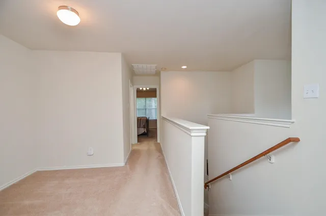a view of storage and utility room with refrigerator