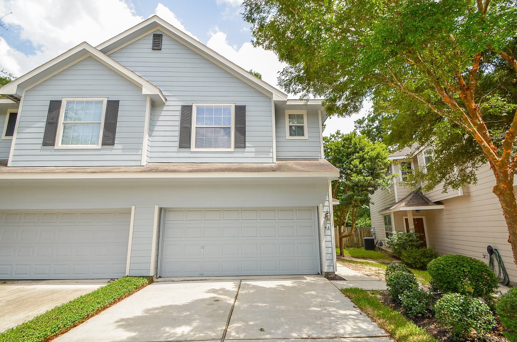 46 East Stedhill Loop Conroe, TX 77384 - Photo 2 of 32 a front view of house with yard