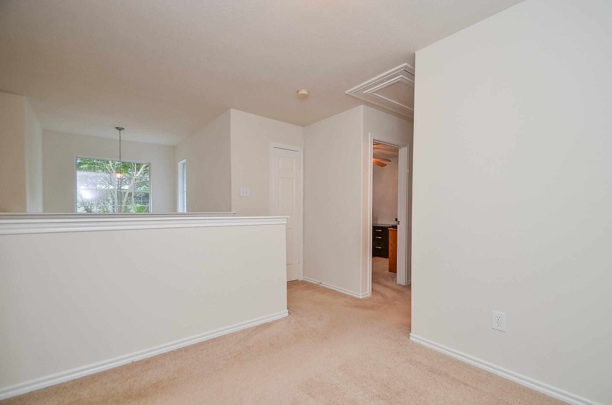 46 East Stedhill Loop Conroe, TX 77384 - Photo 21 of 32 an empty room with windows and closet