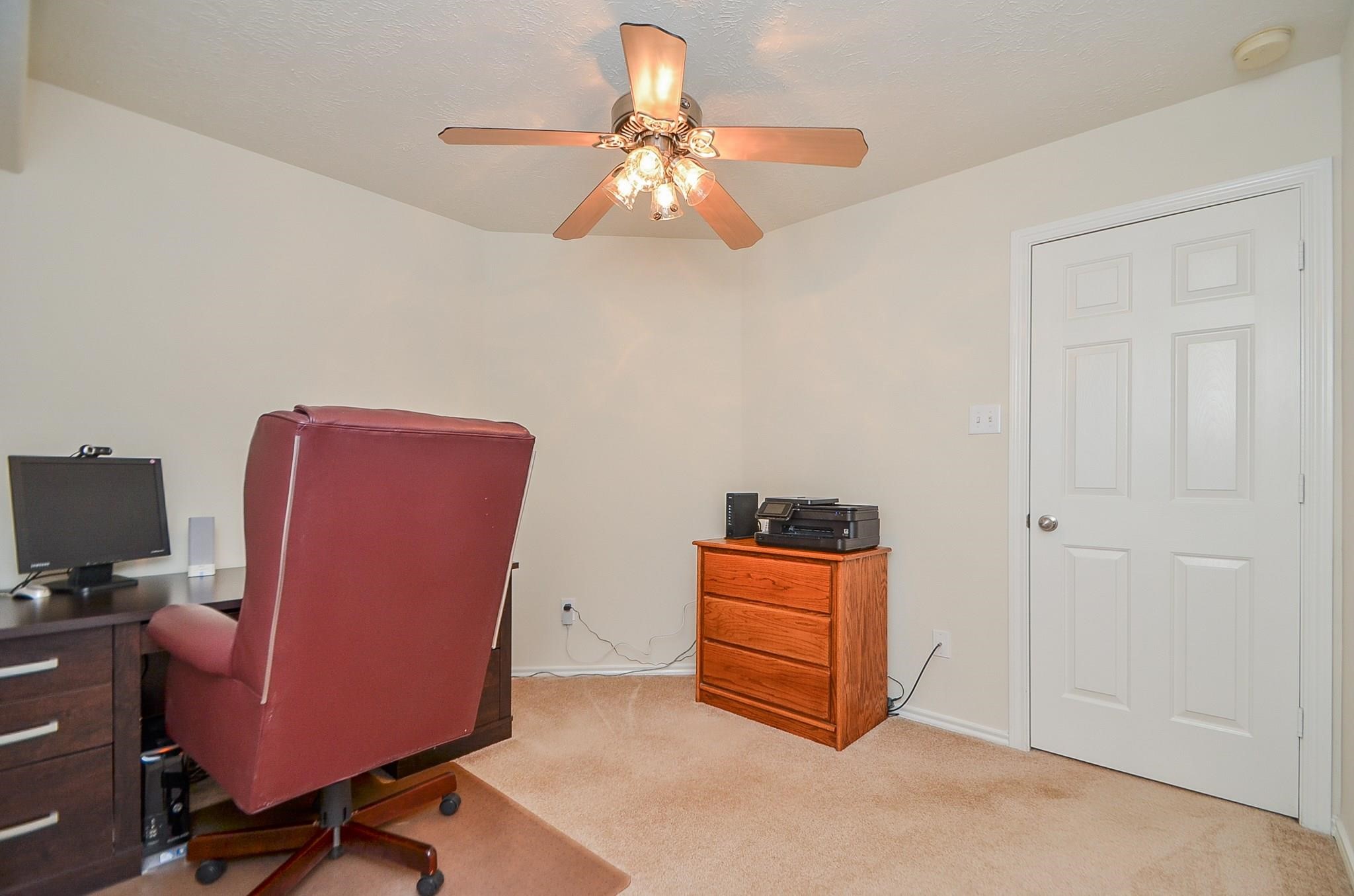 46 East Stedhill Loop Conroe, TX 77384 - Photo 26 of 32 a room with furniture and chandelier