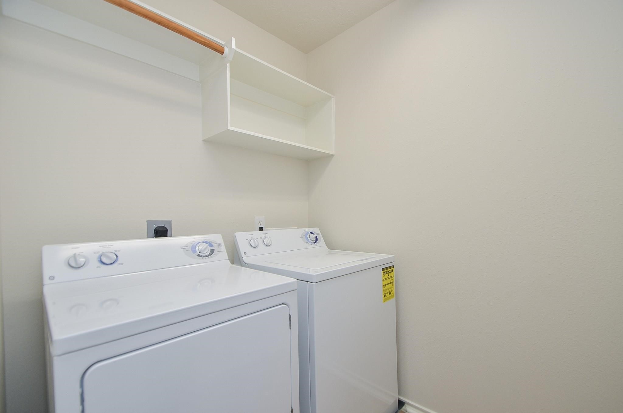 46 East Stedhill Loop Conroe, TX 77384 - Photo 28 of 32 a utility room with dryer and washer