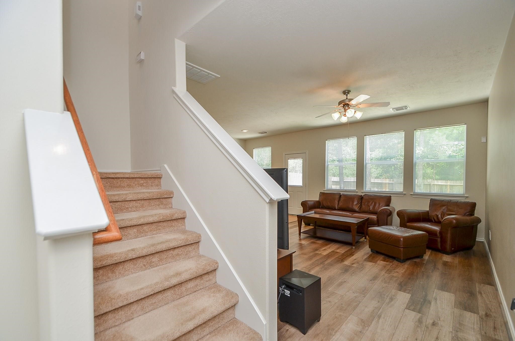 46 East Stedhill Loop Conroe, TX 77384 - Photo 5 of 32 a living room with furniture and a chandelier