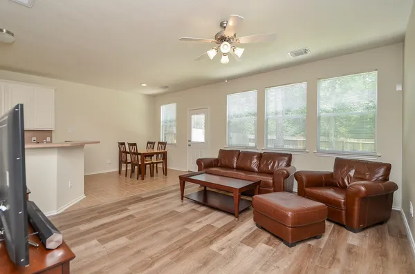 a living room with furniture and a large window