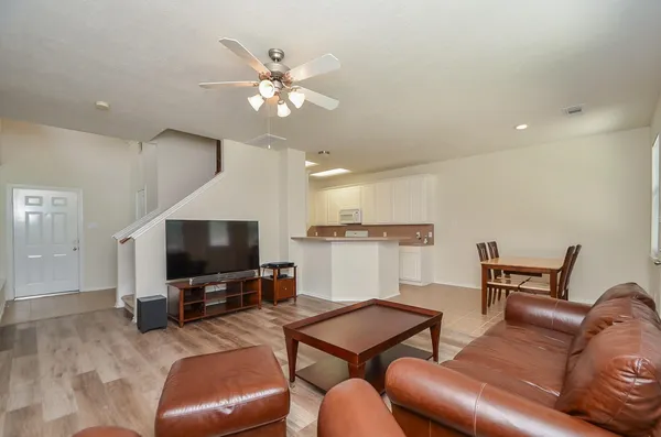 a living room with furniture and a flat screen tv