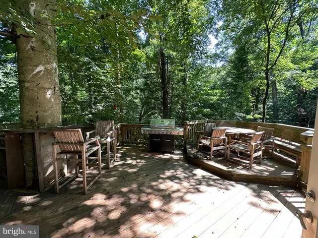 a view of a patio with a table and chairs