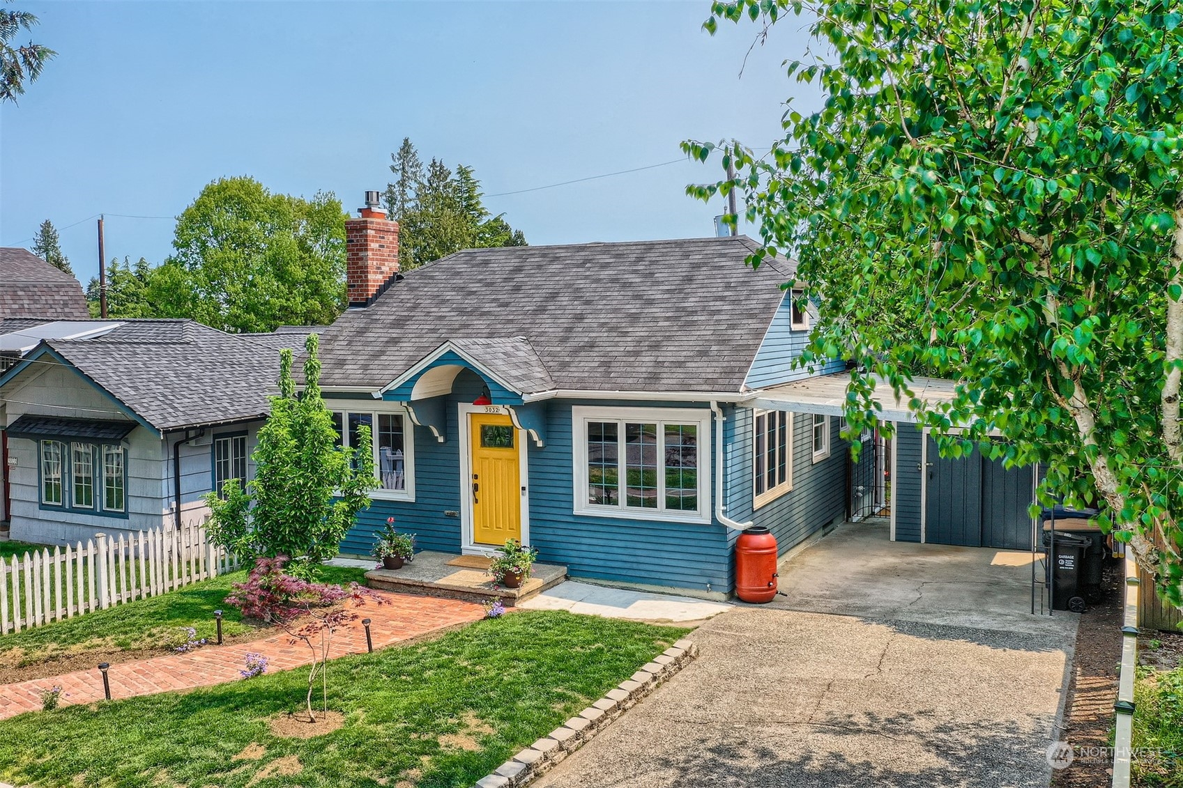 3032 Walnut Avenue Southwest Seattle, WA 98116 - Photo 1 of 29 a front view of a house with a yard