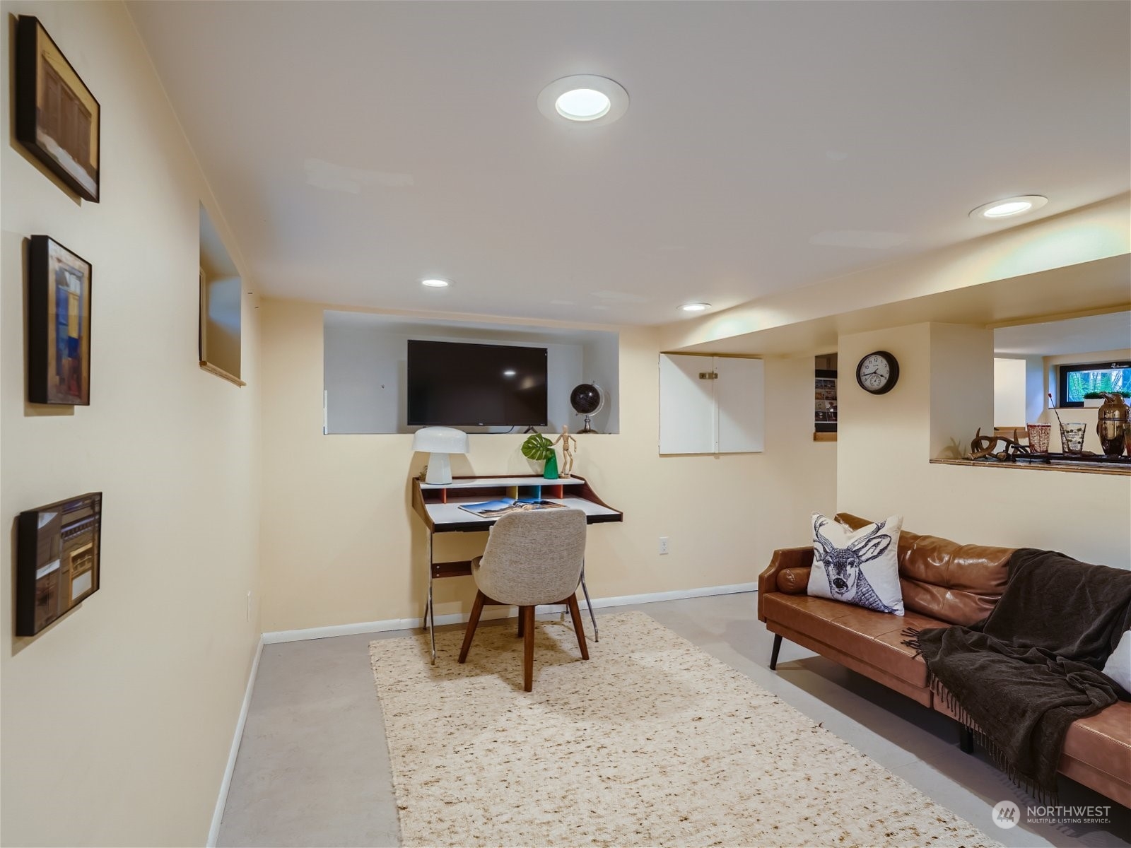 3032 Walnut Avenue Southwest Seattle, WA 98116 - Photo 17 of 29 a living room with furniture and a flat screen tv