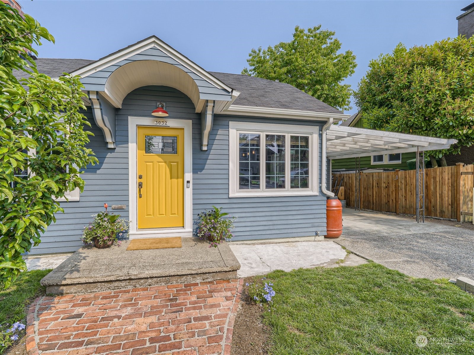 3032 Walnut Avenue Southwest Seattle, WA 98116 - Photo 21 of 29 a front view of a house with a garden