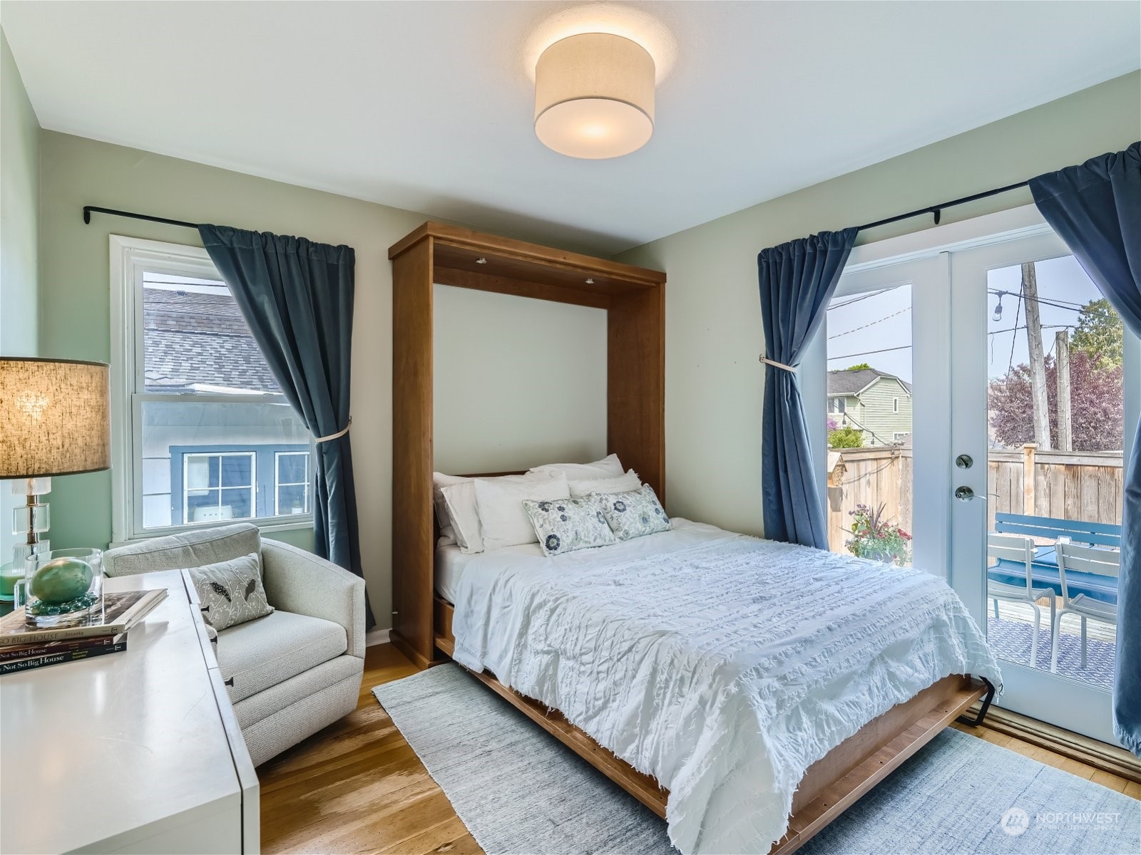 3032 Walnut Avenue Southwest Seattle, WA 98116 - Photo 9 of 29 a bedroom with a bed couch and a window