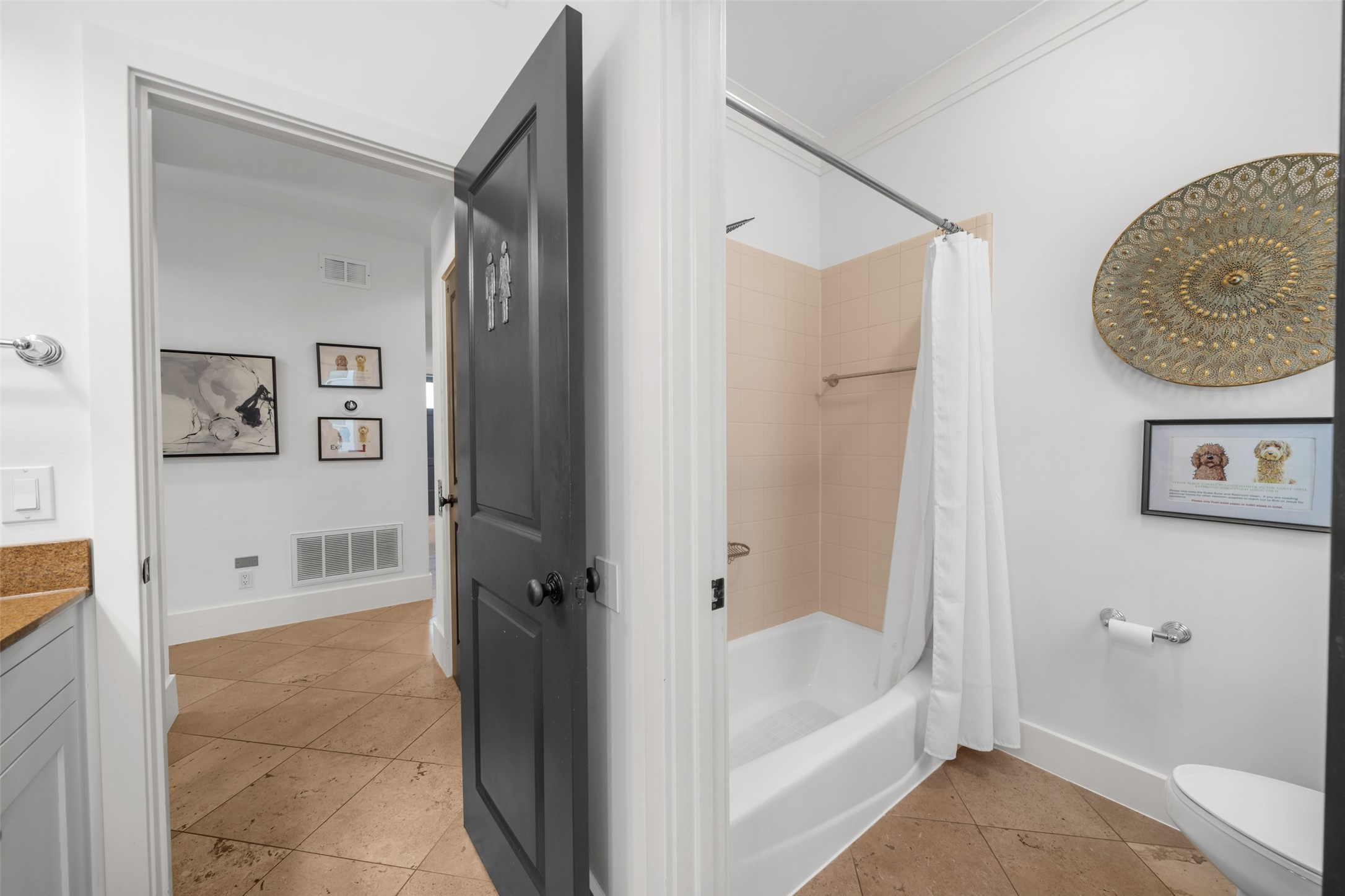 2014 Decatur Street Houston, TX 77007 - Photo 31 of 41 a bathroom with a tub shower and mirror