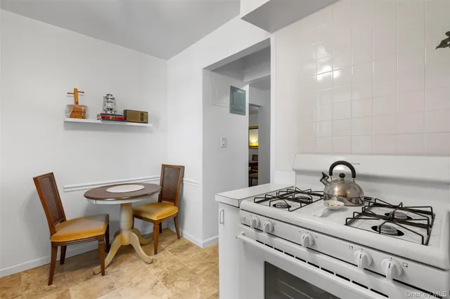 a kitchen with a stove a sink and a stove