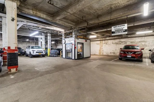 a view of parking garage with cars