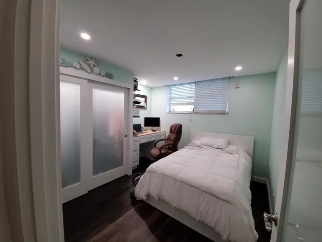 a kitchen with a refrigerator and a sink