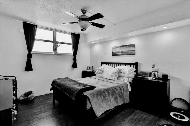 a bedroom with bed window and furniture