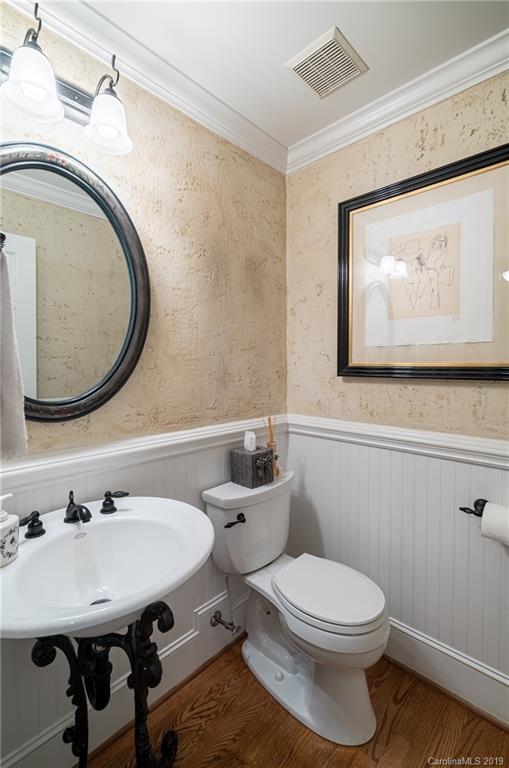 3200 Wickersham Road Charlotte, NC 28211 - Photo 12 of 40 a bathroom with a toilet a sink and a mirror