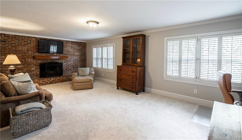 3200 Wickersham Road Charlotte, NC 28211 - Photo 18 of 40 a living room with furniture and a fireplace