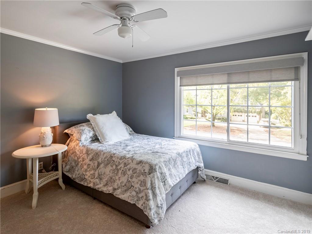 3200 Wickersham Road Charlotte, NC 28211 - Photo 23 of 40 a bedroom with a bed and a window