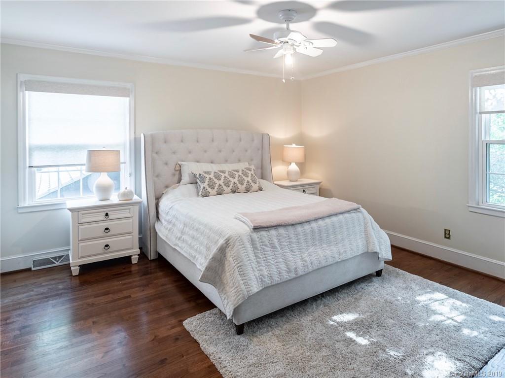 3200 Wickersham Road Charlotte, NC 28211 - Photo 25 of 40 a bedroom with a bed and window